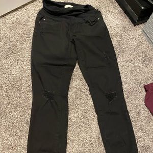 Distressed black maternity jeans with raw hem